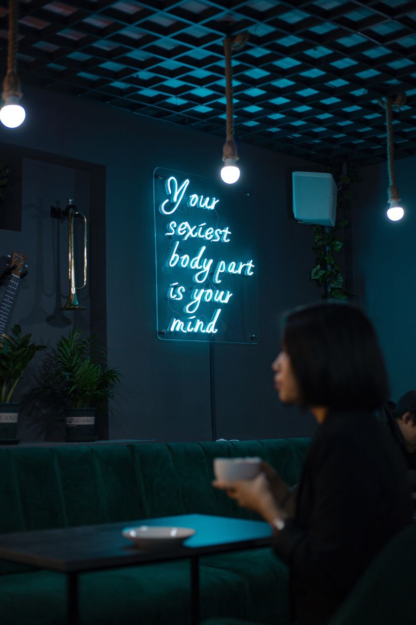 May be an image of 1 person, lighting and drink