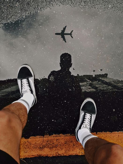 May be an image of 1 person, helicopter, skateboard, wingtip shoes and blimp