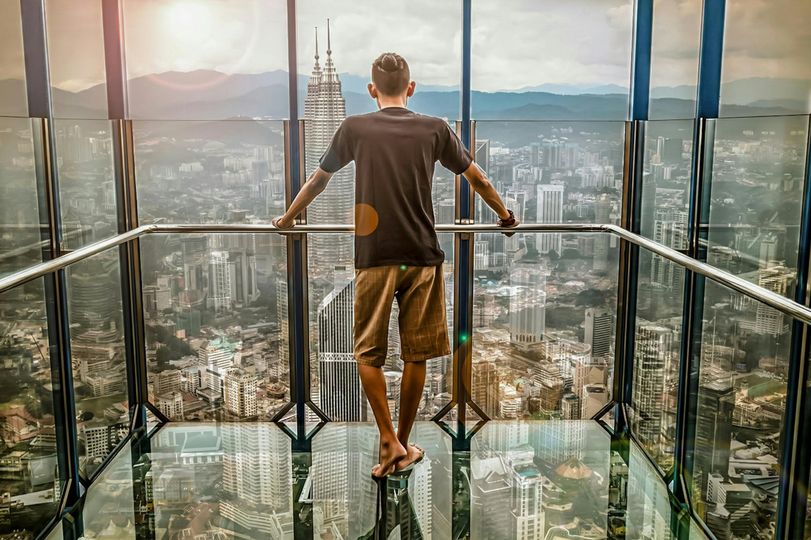 May be an image of 1 person, skyscraper and Victoria Peak
