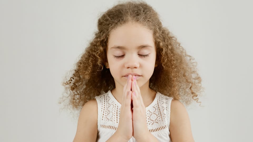 May be an image of 1 person, child and practicing yoga