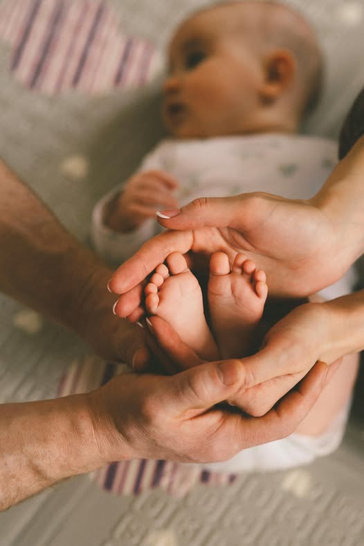 May be an image of 1 person and baby