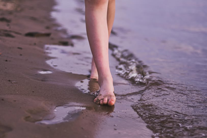 May be an image of 1 person, child, anklet, beach and body of water